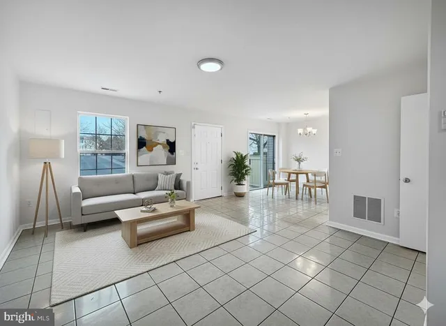 a living room with furniture and a table