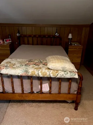 a view of a room with bed
