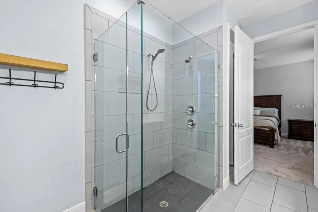 a bathroom with a shower and a sink