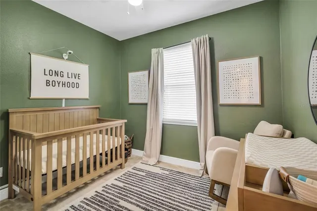 a bedroom with furniture and a window