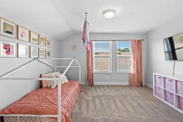 a bed room with a bed and a window