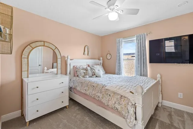 a bedroom with a bed and a dresser