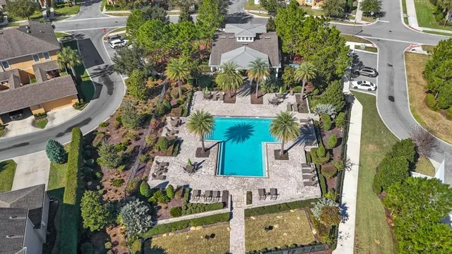 an aerial view of a residential apartment building with a yard