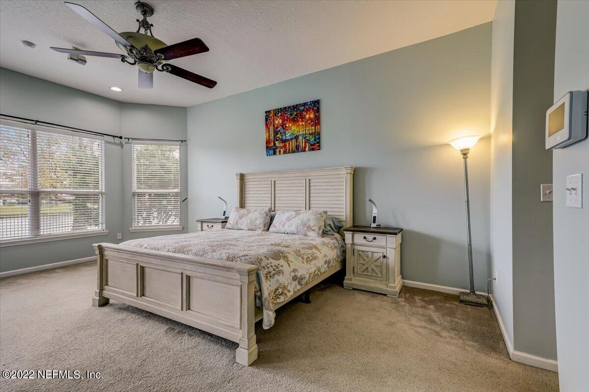 697 Porta Rosa Circle St. Augustine, FL 32092 - Photo 20 of 43 a bedroom with a bed dresser and a window