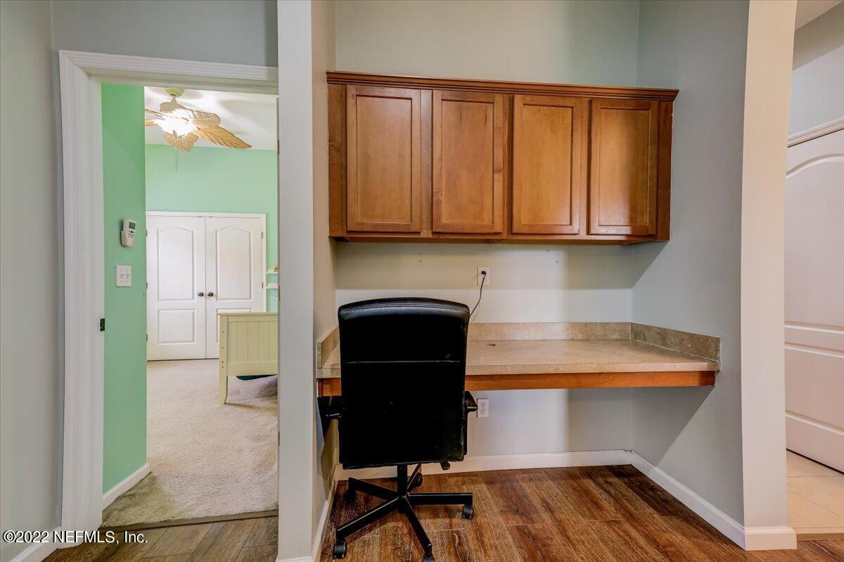 697 Porta Rosa Circle St. Augustine, FL 32092 - Photo 23 of 43 a view of a kitchen with furniture and a fireplace