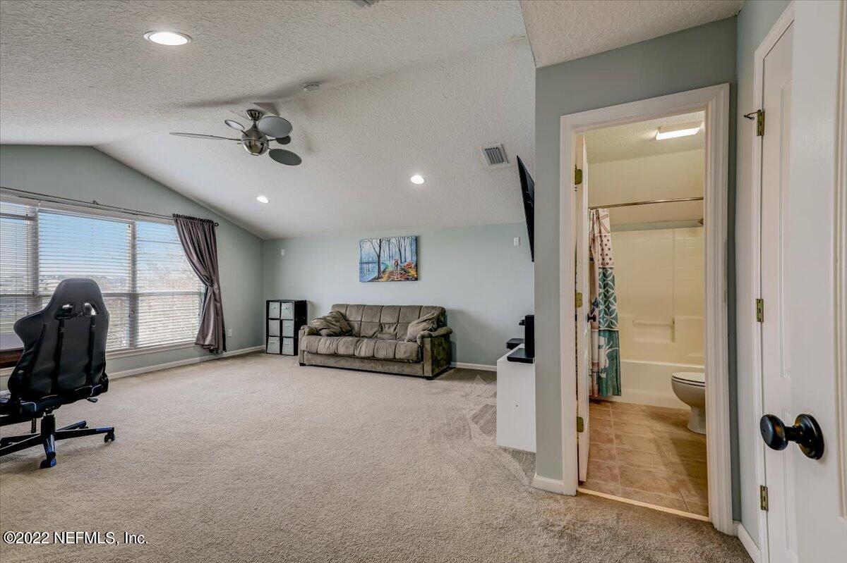697 Porta Rosa Circle St. Augustine, FL 32092 - Photo 30 of 43 a view of a livingroom with furniture and a window