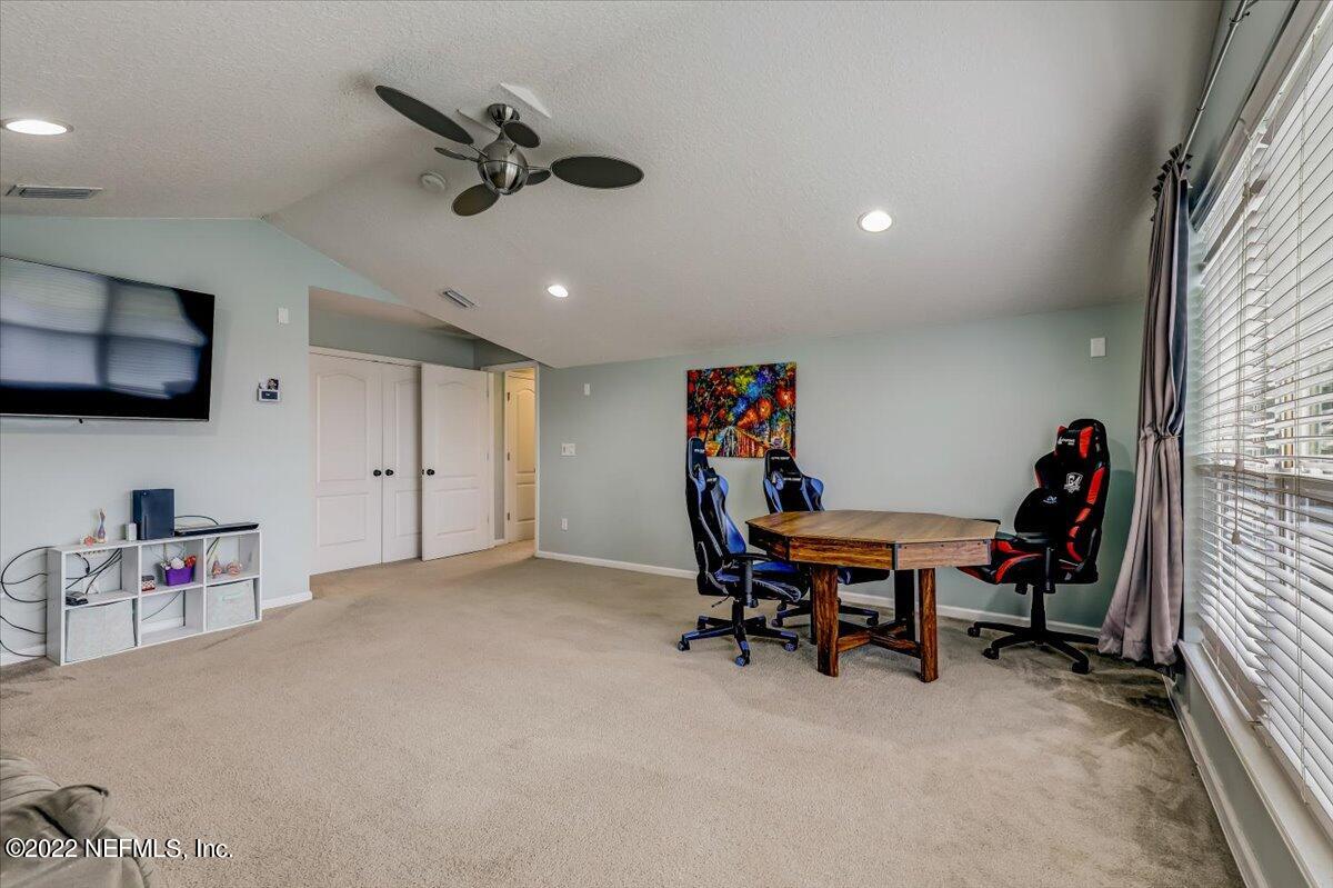 697 Porta Rosa Circle St. Augustine, FL 32092 - Photo 31 of 43 a workspace with furniture and a ceiling fan
