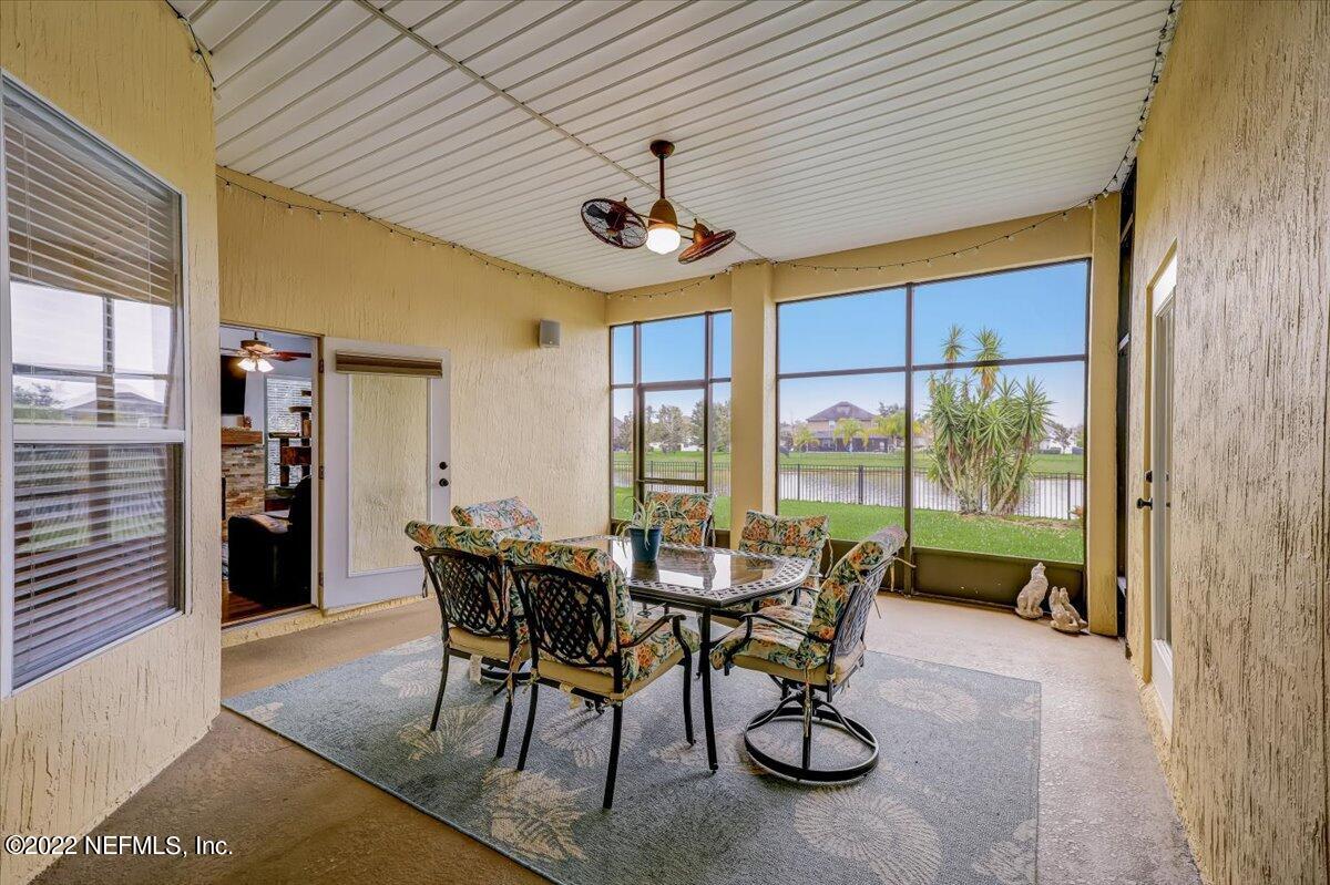 697 Porta Rosa Circle St. Augustine, FL 32092 - Photo 33 of 43 a dining room with furniture water view and a floor to ceiling window