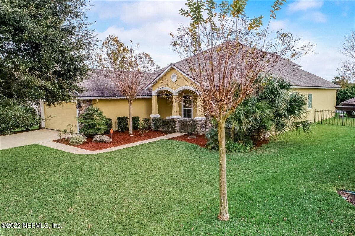 697 Porta Rosa Circle St. Augustine, FL 32092 - Photo 36 of 43 a view of a house with backyard and garden