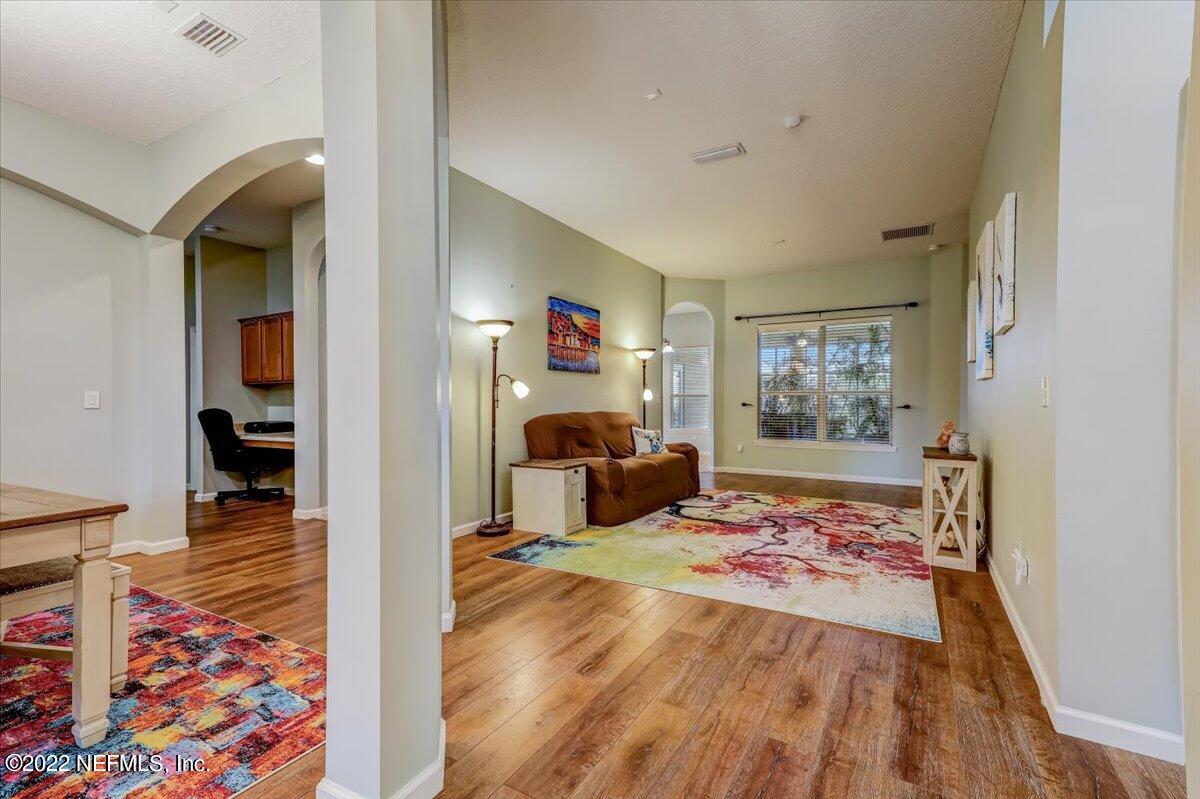 697 Porta Rosa Circle St. Augustine, FL 32092 - Photo 4 of 43 a bedroom with furniture and a wooden floor