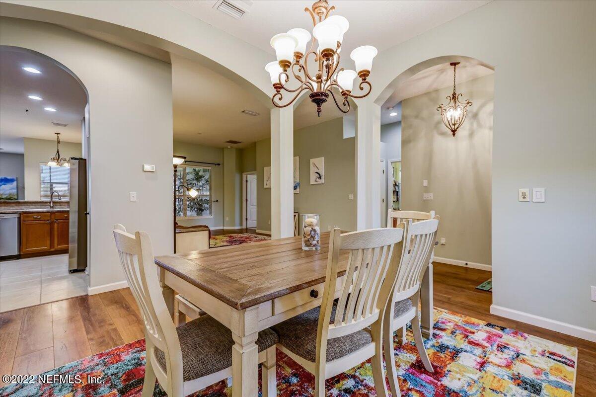 697 Porta Rosa Circle St. Augustine, FL 32092 - Photo 5 of 43 a view of a dining room with furniture and chandelier