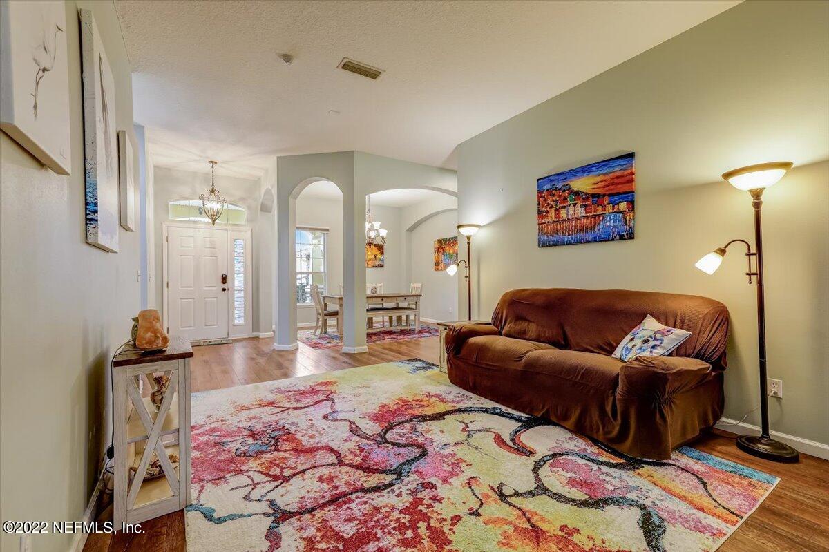 697 Porta Rosa Circle St. Augustine, FL 32092 - Photo 7 of 43 a living room with furniture and a rug