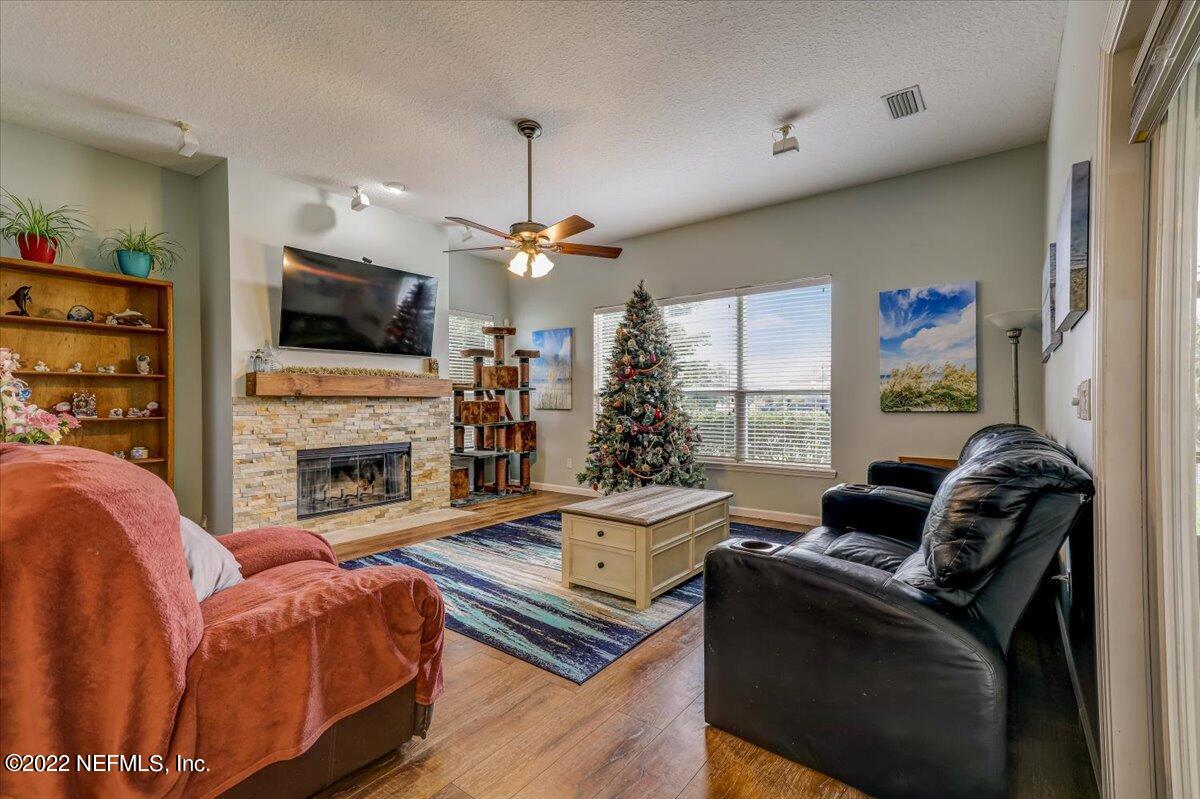 697 Porta Rosa Circle St. Augustine, FL 32092 - Photo 8 of 43 a living room with furniture fireplace and flat screen tv