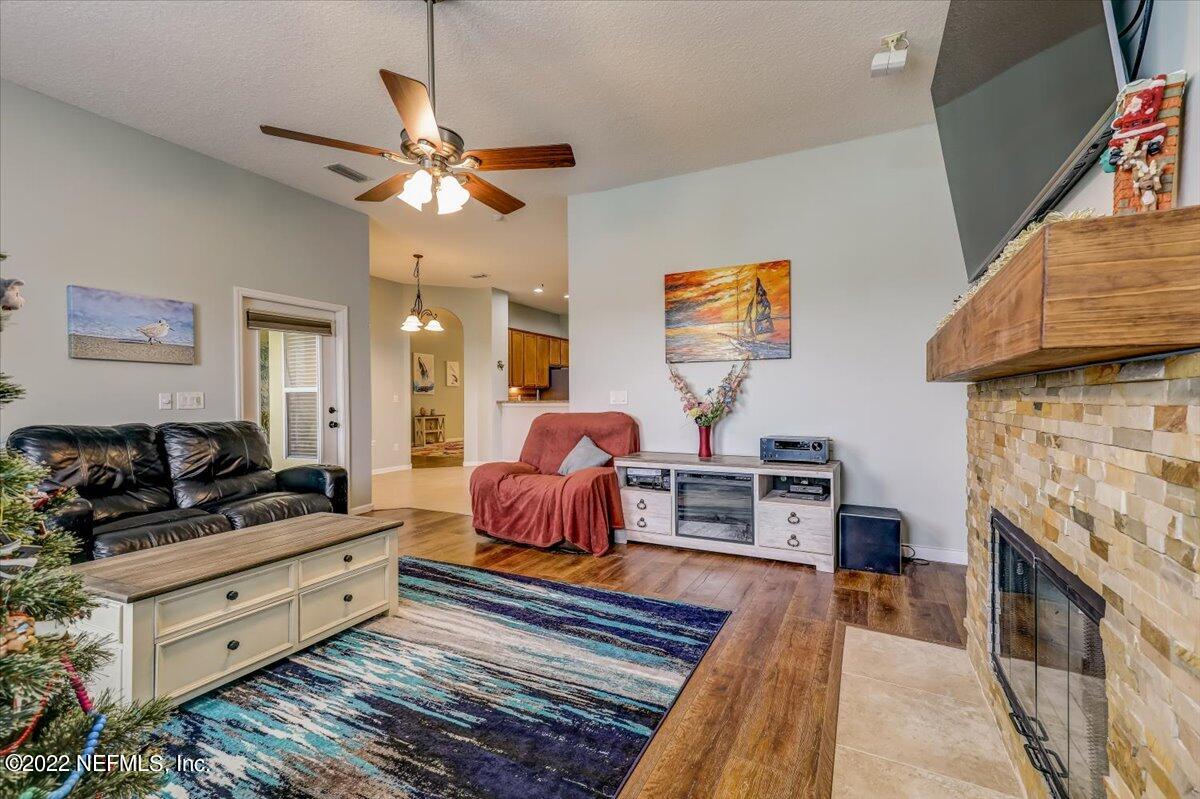 697 Porta Rosa Circle St. Augustine, FL 32092 - Photo 9 of 43 a living room with furniture and a fireplace