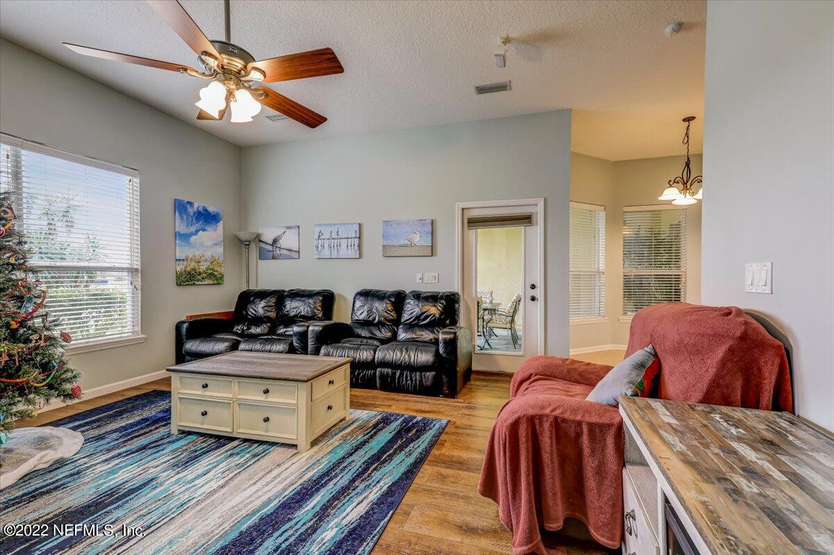 697 Porta Rosa Circle St. Augustine, FL 32092 - Photo 10 of 43 a living room with furniture and a flat screen tv