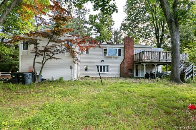 1 Charlotte Drive Spring Valley, NY 10977 - Photo 12 of 25 Rear view of property featuring a lawn and a deck