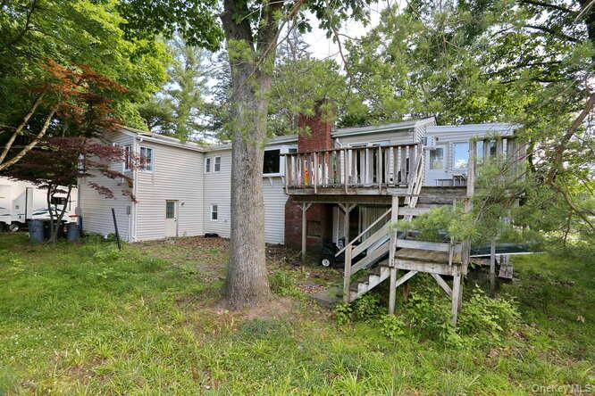 1 Charlotte Drive Spring Valley, NY 10977 - Photo 13 of 25 Rear view of house featuring a wooden deck