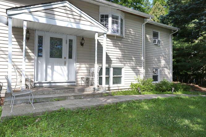 1 Charlotte Drive Spring Valley, NY 10977 - Photo 4 of 25 a front view of a house with a yard