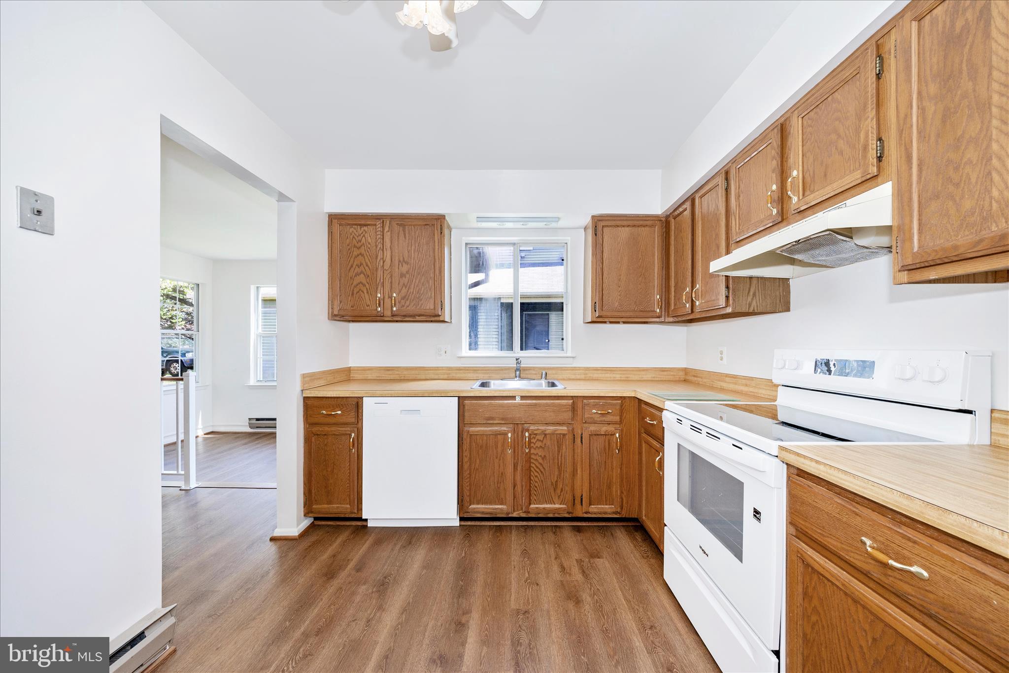 5738 Box Elder Court Frederick, MD 21703 - Photo 14 of 50 a kitchen with a sink cabinets stainless steel appliances and a window