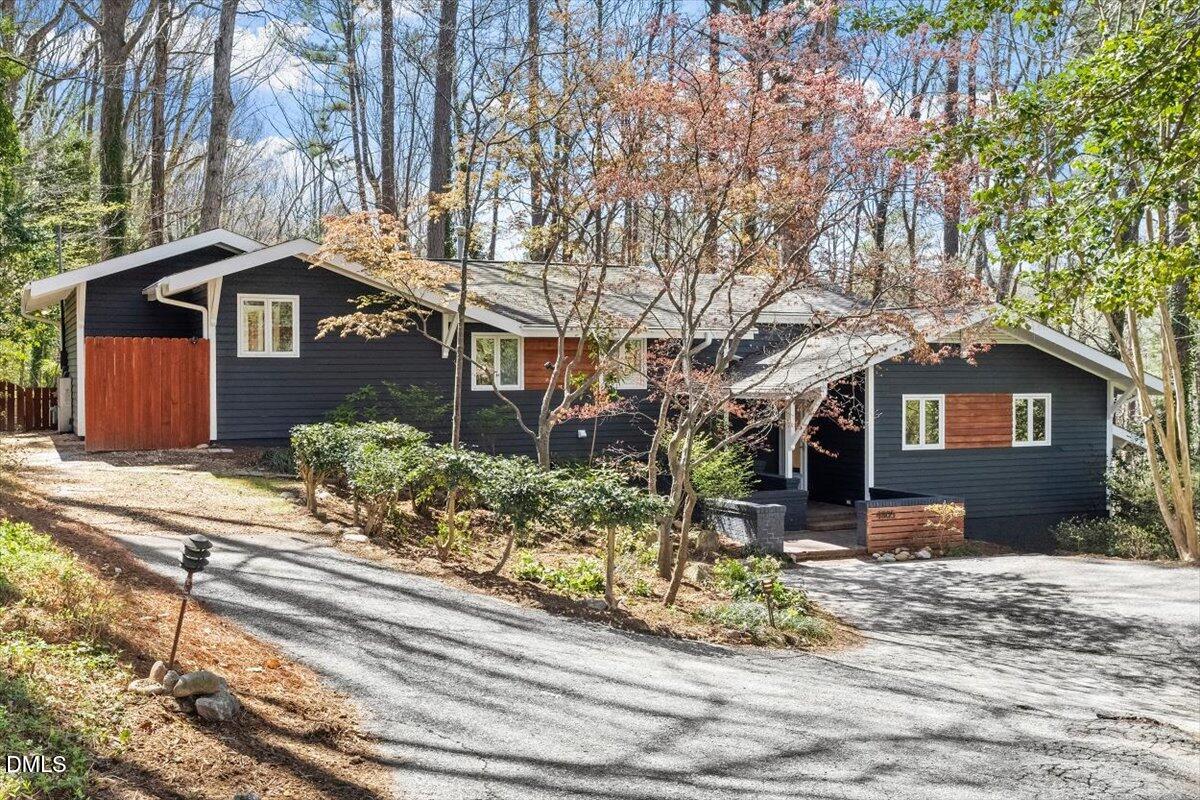 4805 Rembert Drive Raleigh, NC 27612 - Photo 1 of 45 a front view of a house with a yard