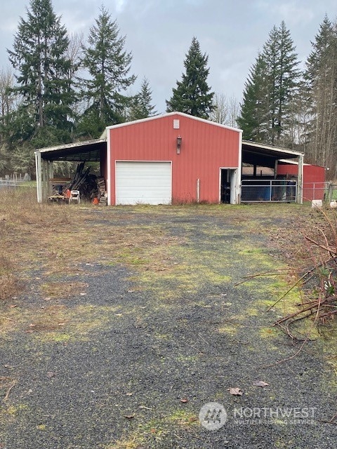 158 Leudinghaus Road Chehalis, WA 98532 - Photo 2 of 3 a backyard of a house with wooden fence and trees