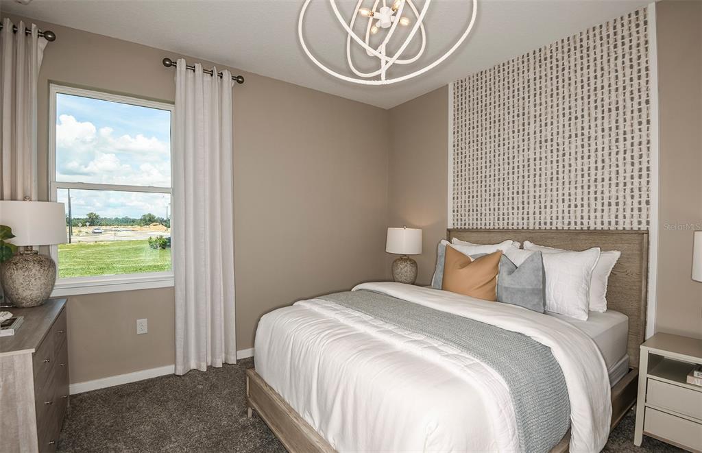 3768 Obsidian Drive Spring Hill, FL 34609 - Photo 18 of 24 a bedroom with a bed and a window