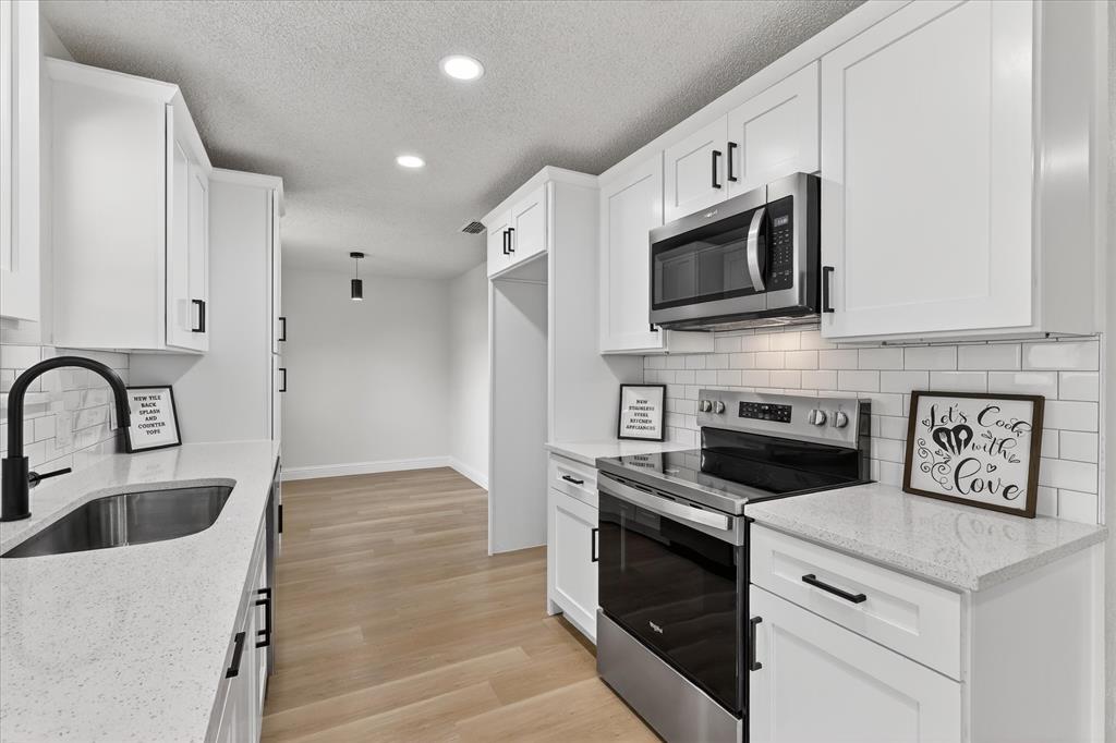 6425 Summit Ridge Drive Watauga, TX 76148 - Photo 8 of 18 Fully updated kitchen.New cabinets. New appliances. New everything