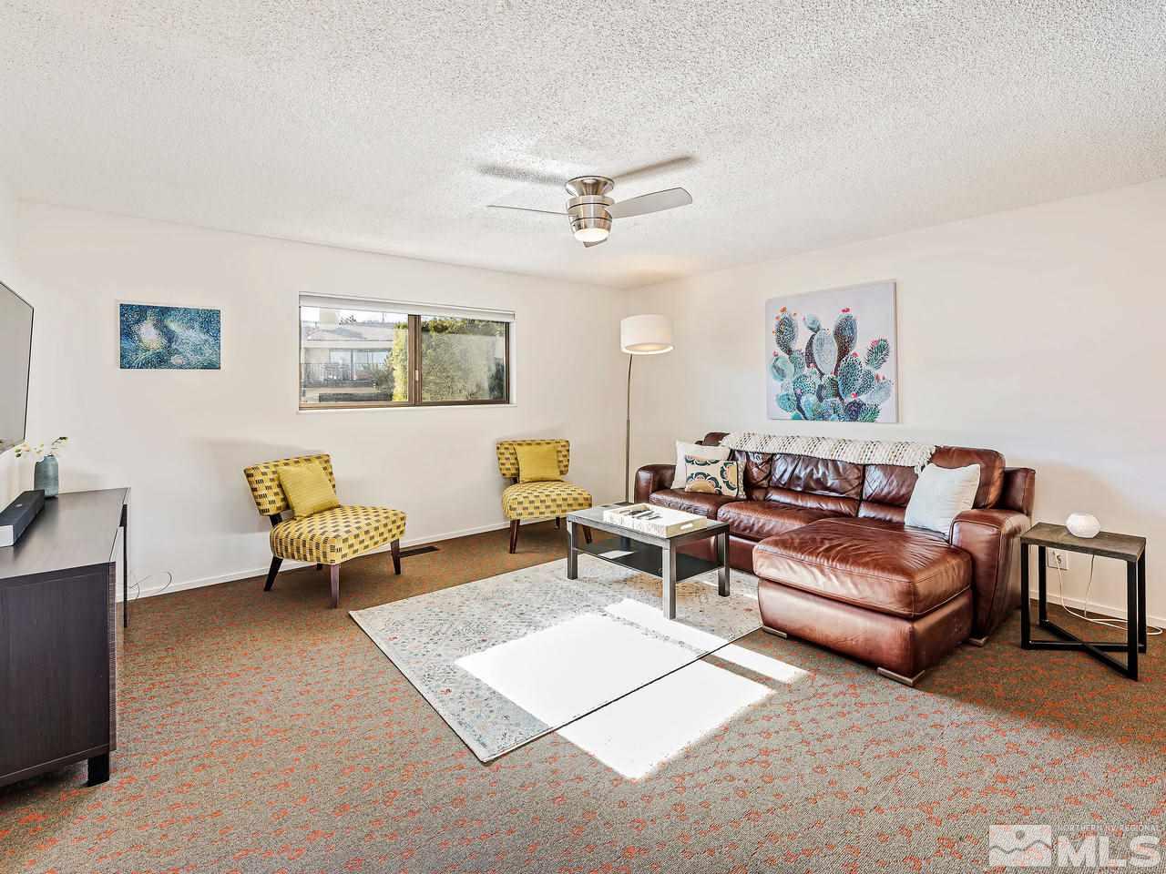 3447 Skyline Boulevard Reno, NV 89509 - Photo 13 of 24 a living room with furniture and a window