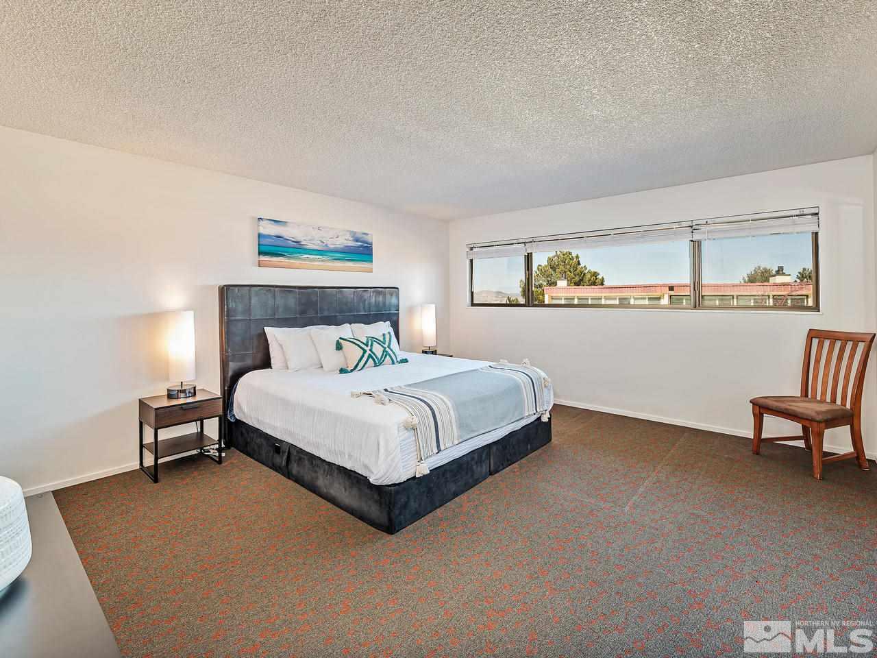 3447 Skyline Boulevard Reno, NV 89509 - Photo 15 of 24 a bedroom with a bed chair and a window