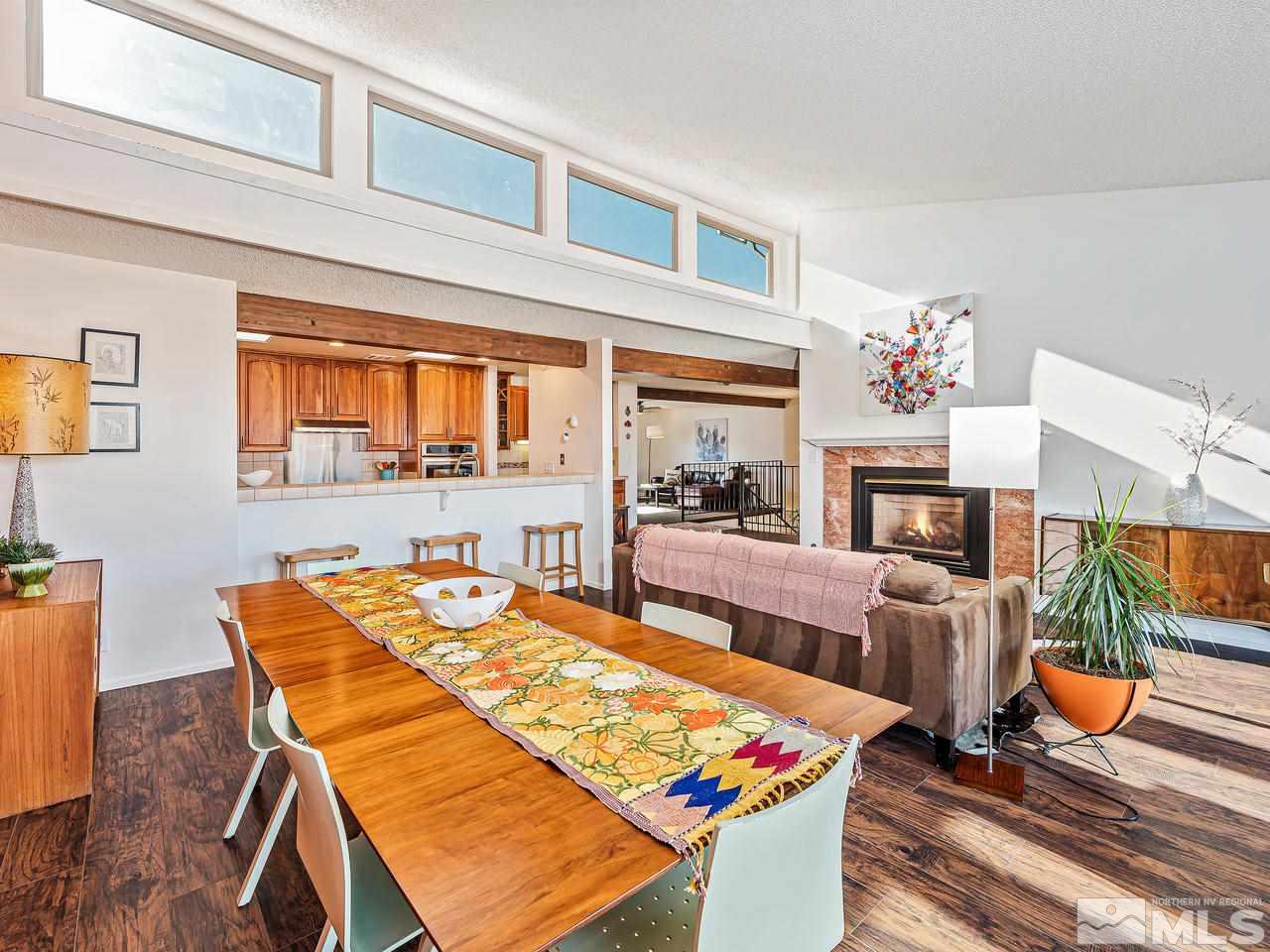 3447 Skyline Boulevard Reno, NV 89509 - Photo 6 of 24 a living room with fireplace furniture and a table