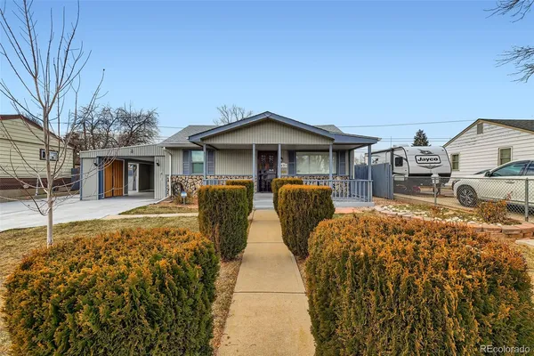 a front view of a house with garden
