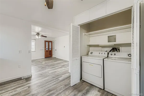 a view of a storage & utility room with washer and dryer