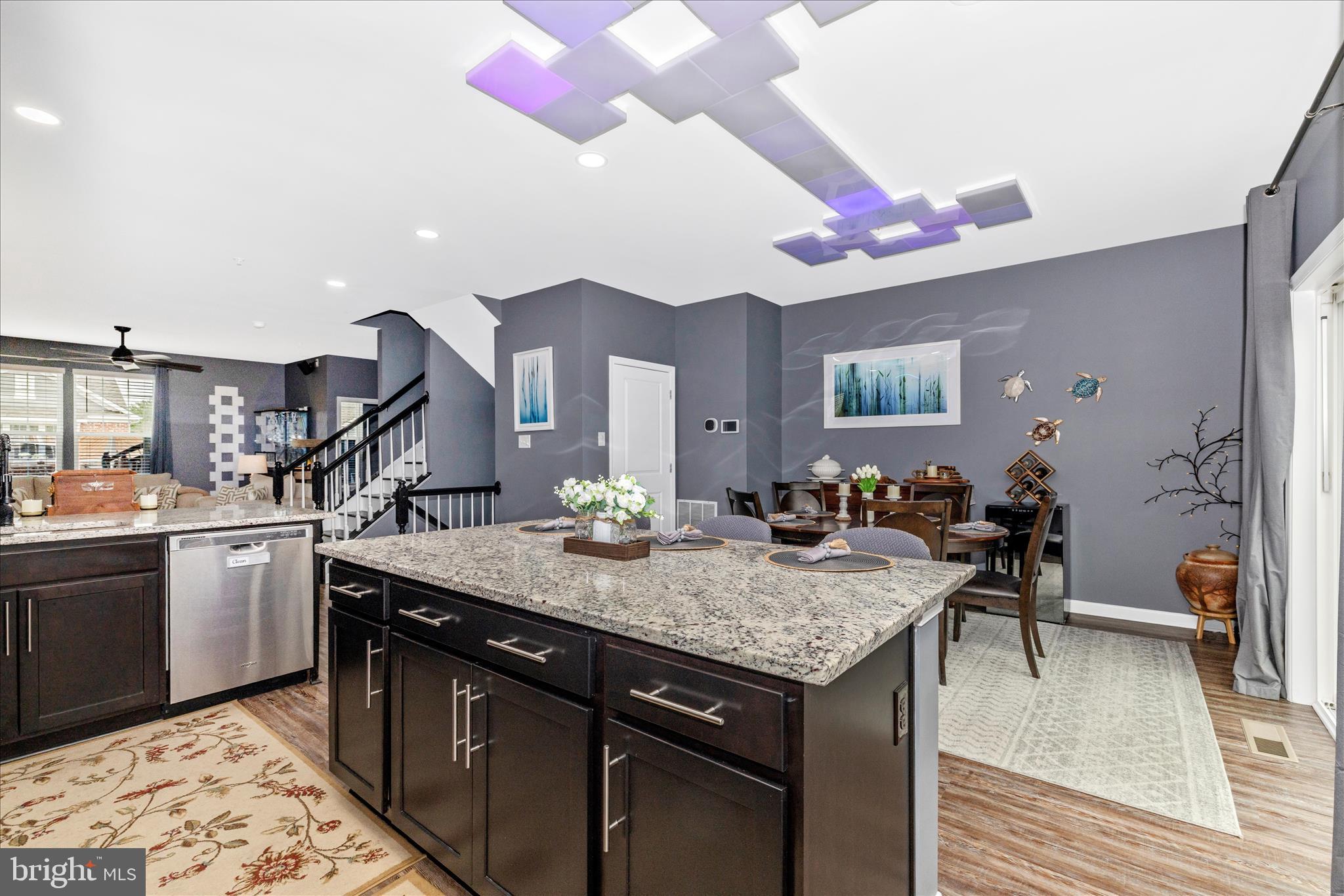 7001 Freedom Way Frederick, MD 21703 - Photo 14 of 65 a kitchen with a stove a faucet a dining table and chairs