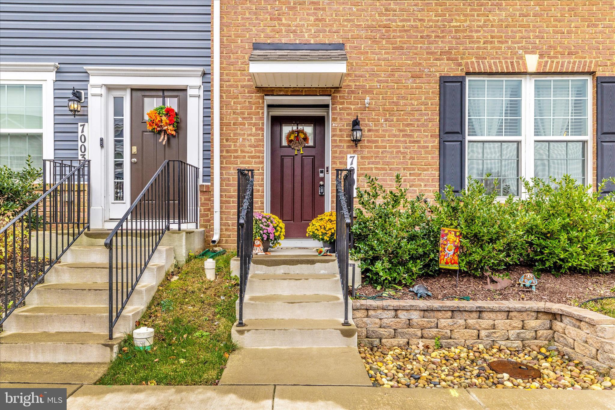 7001 Freedom Way Frederick, MD 21703 - Photo 2 of 65 a view of a house with potted plants and a pathway