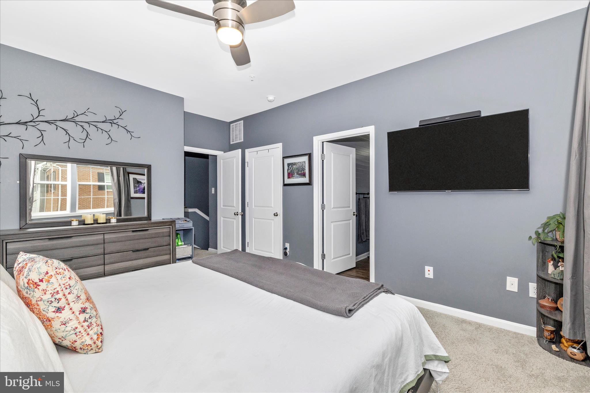 7001 Freedom Way Frederick, MD 21703 - Photo 28 of 65 a bedroom with a bed and a flat screen tv