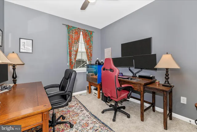 a bedroom with a bed and a television