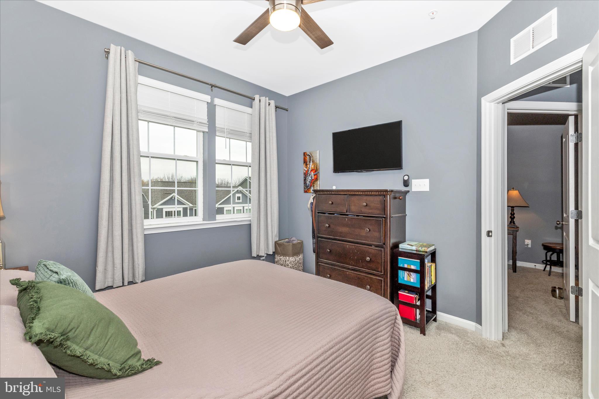 7001 Freedom Way Frederick, MD 21703 - Photo 37 of 65 a bedroom with a bed and a television