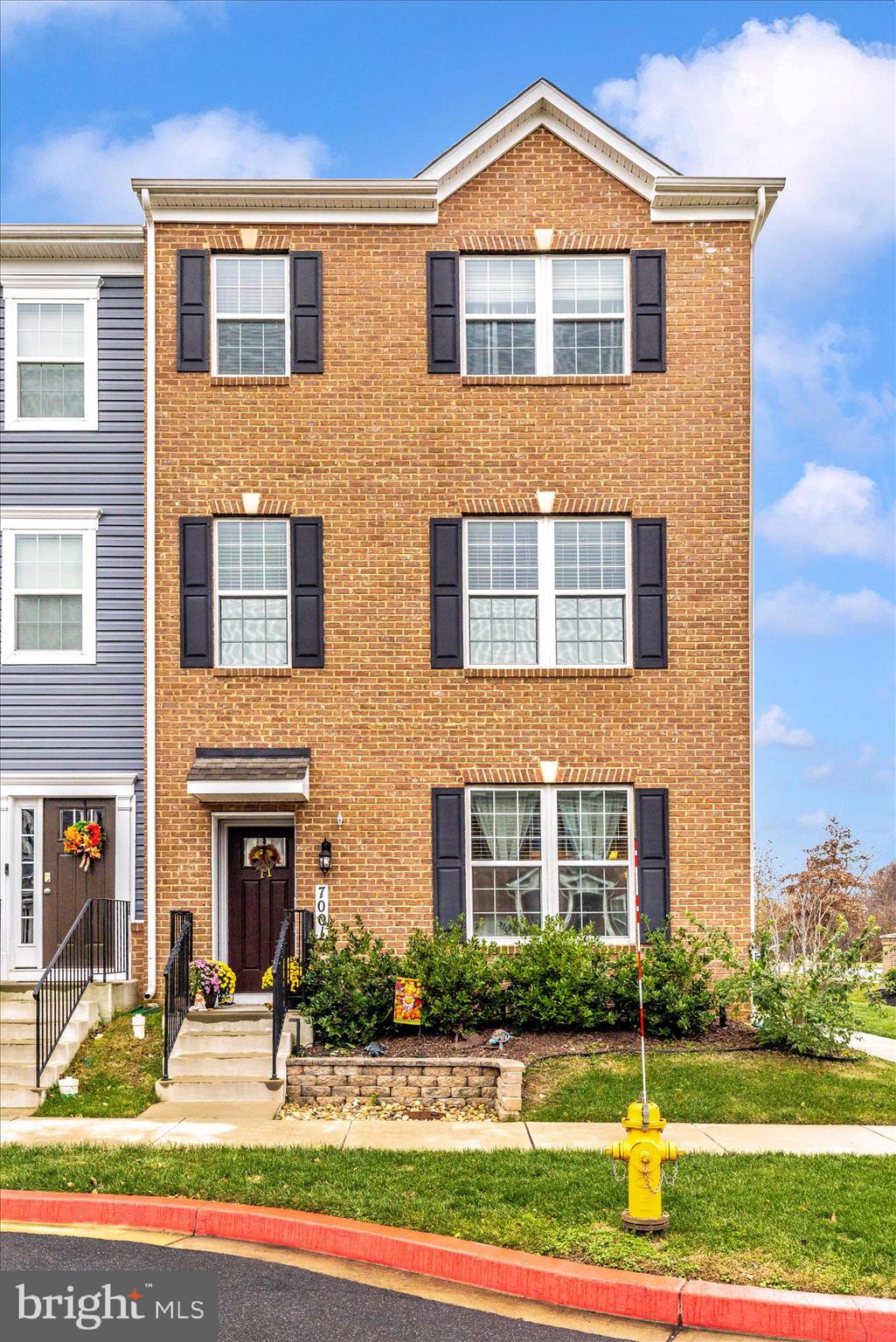 7001 Freedom Way Frederick, MD 21703 - Photo 42 of 65 a front view of a house with a yard