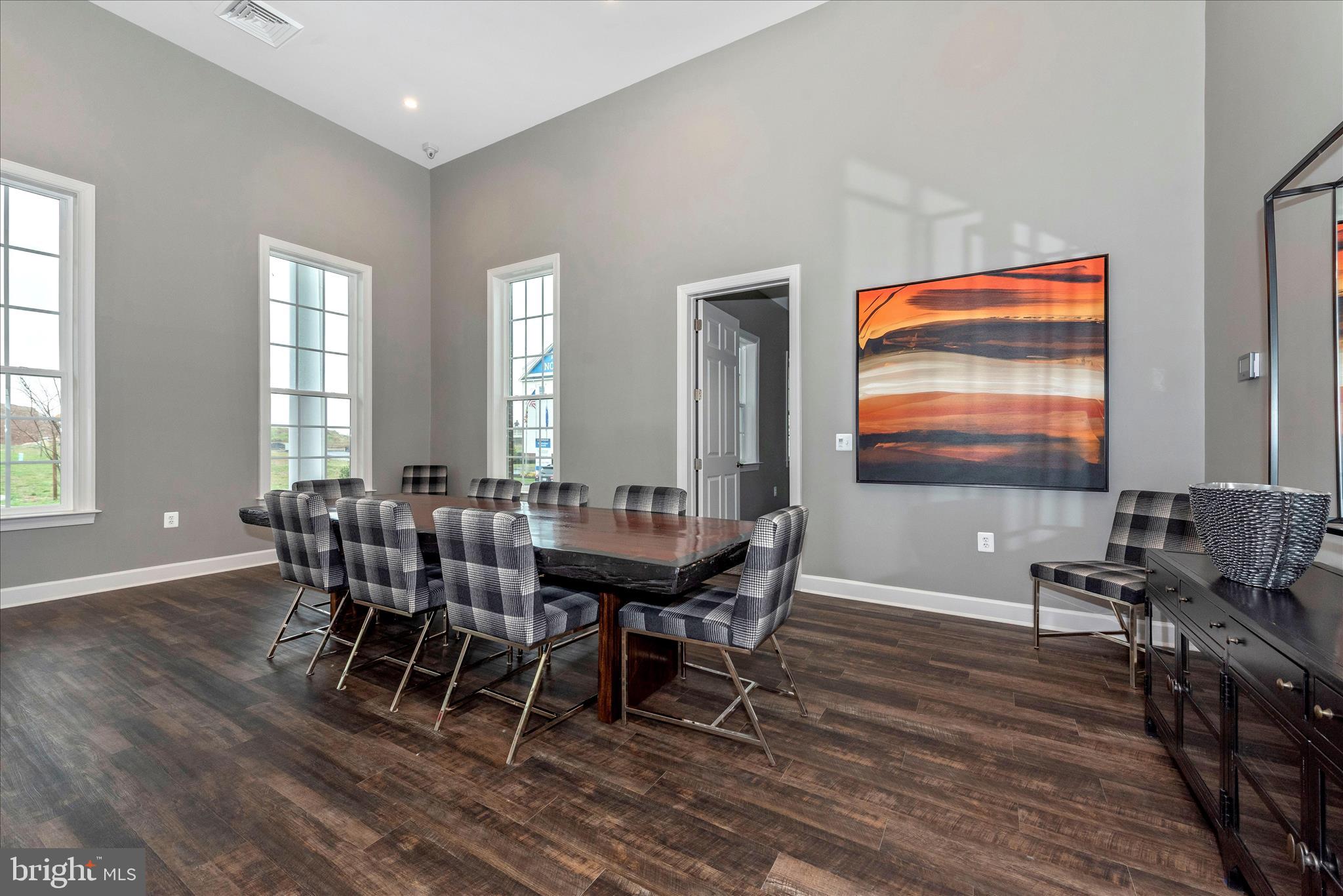 7001 Freedom Way Frederick, MD 21703 - Photo 56 of 65 a view of a dining room with furniture window and wooden floor