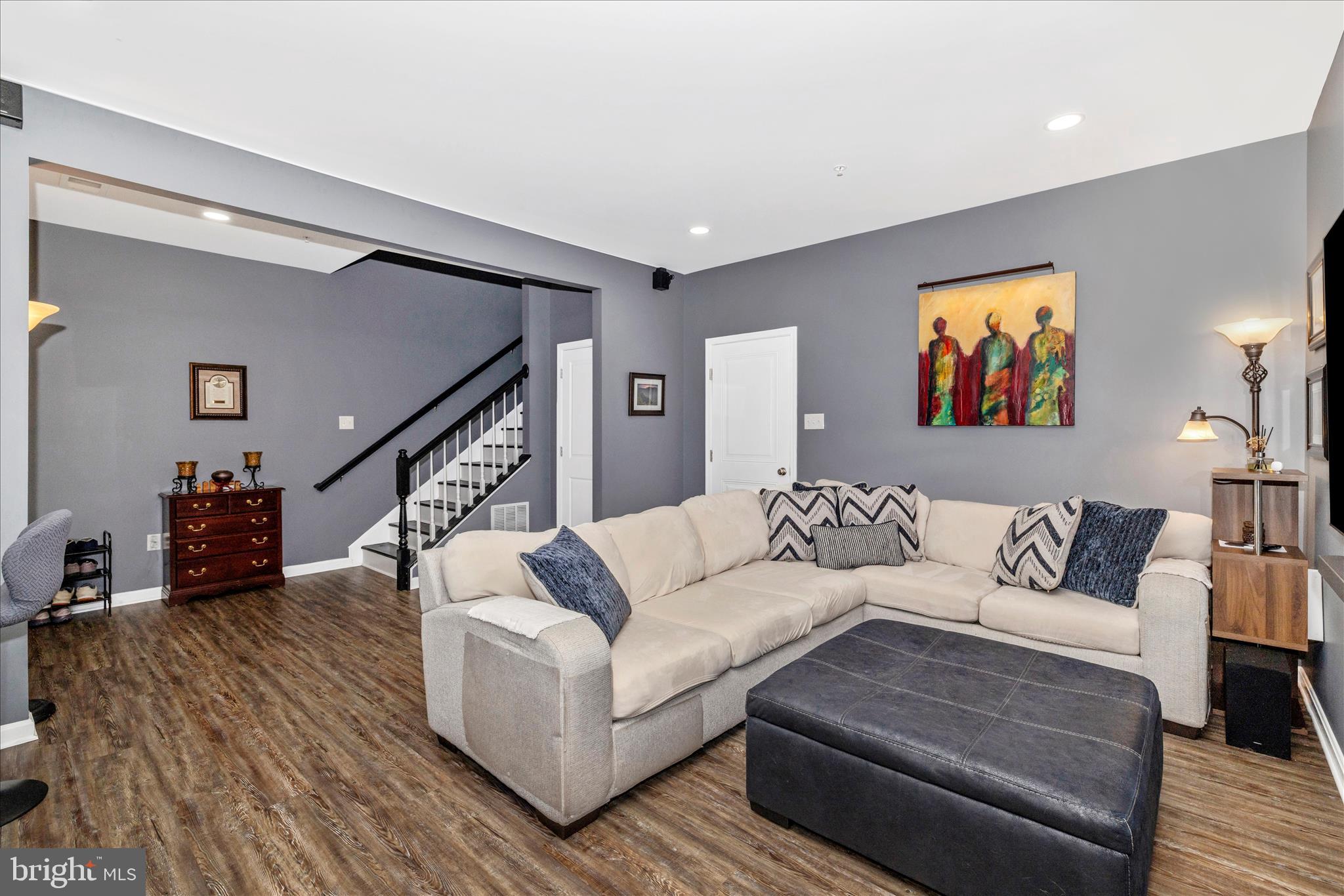7001 Freedom Way Frederick, MD 21703 - Photo 6 of 65 a living room with furniture and a painting on the wall