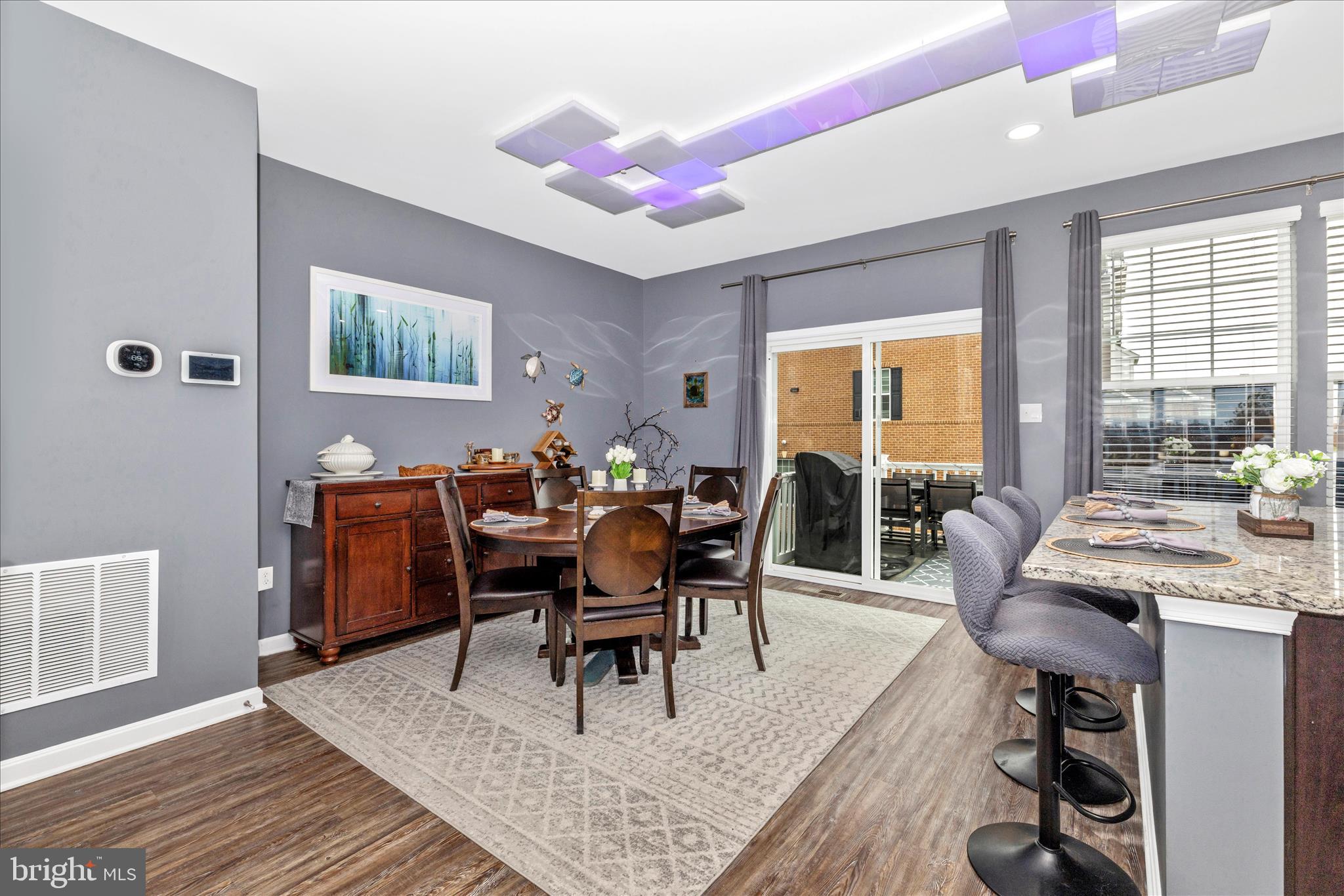 7001 Freedom Way Frederick, MD 21703 - Photo 7 of 65 a living room with furniture a wooden floor and next to a window