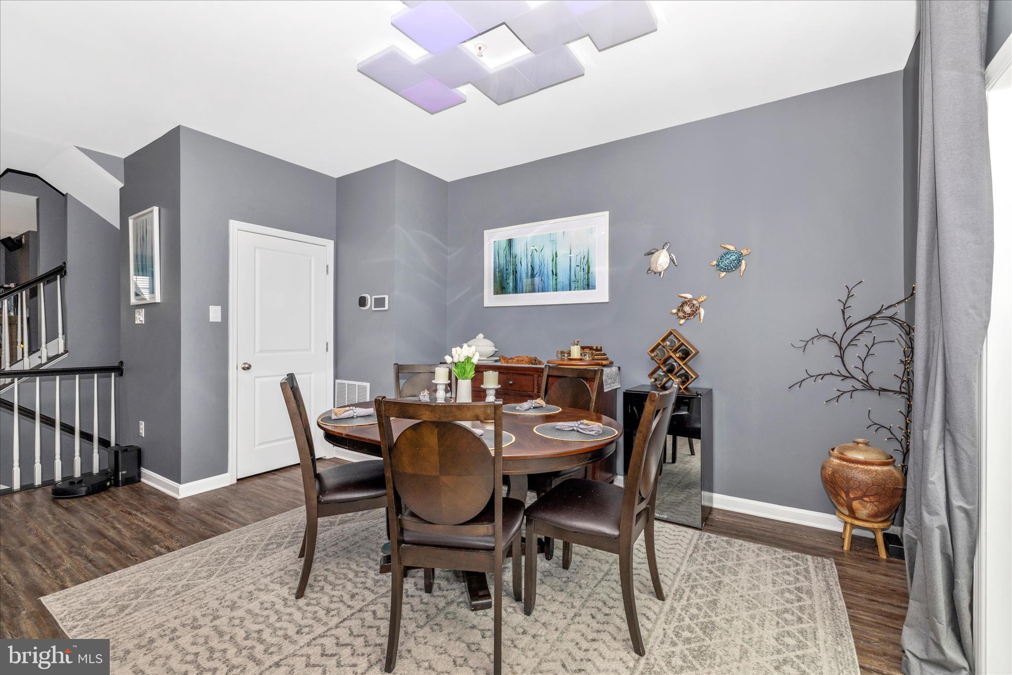 7001 Freedom Way Frederick, MD 21703 - Photo 9 of 65 a view of a dining room with furniture and wooden floor