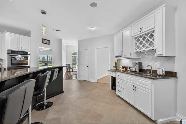 a white toilet sitting next to a bathroom sink