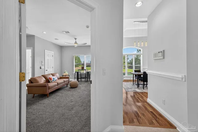 a living room with furniture and a table