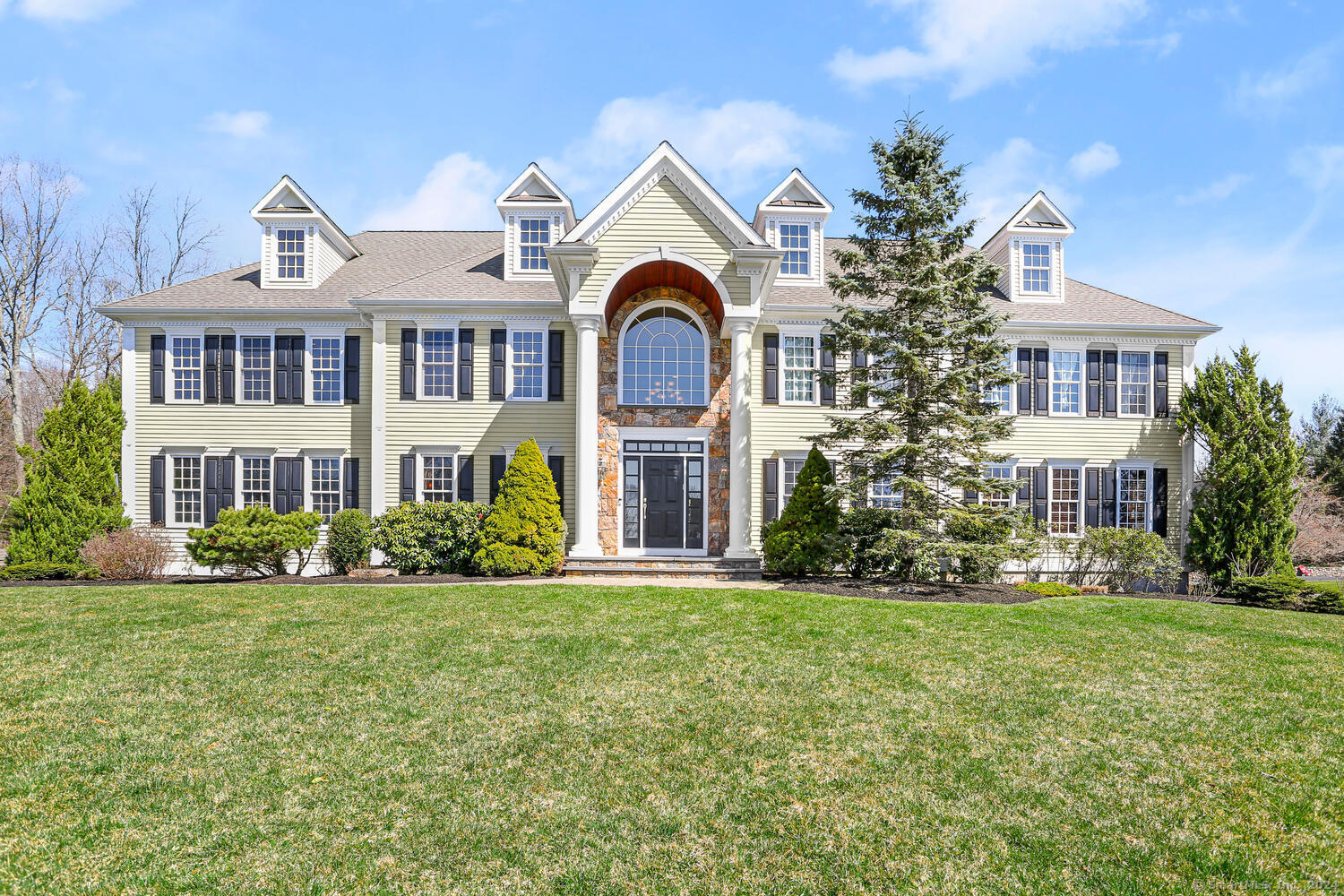 65 Old Tree Farm Lane Trumbull, CT 06611 - Photo 1 of 1 a front view of a house with a garden