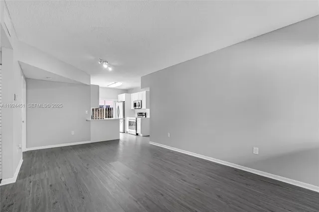 a view of a livingroom with wooden floor