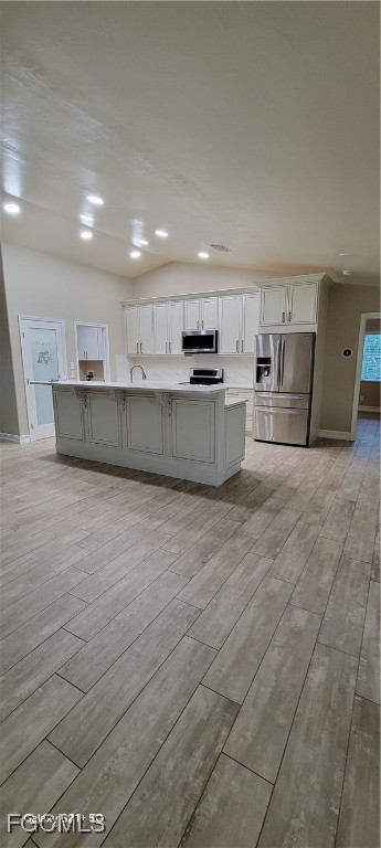 4030 27th Street Southwest Lehigh Acres, FL 33976 - Photo 2 of 7 a large kitchen with stainless steel appliances granite countertop a large counter top and a stove top oven