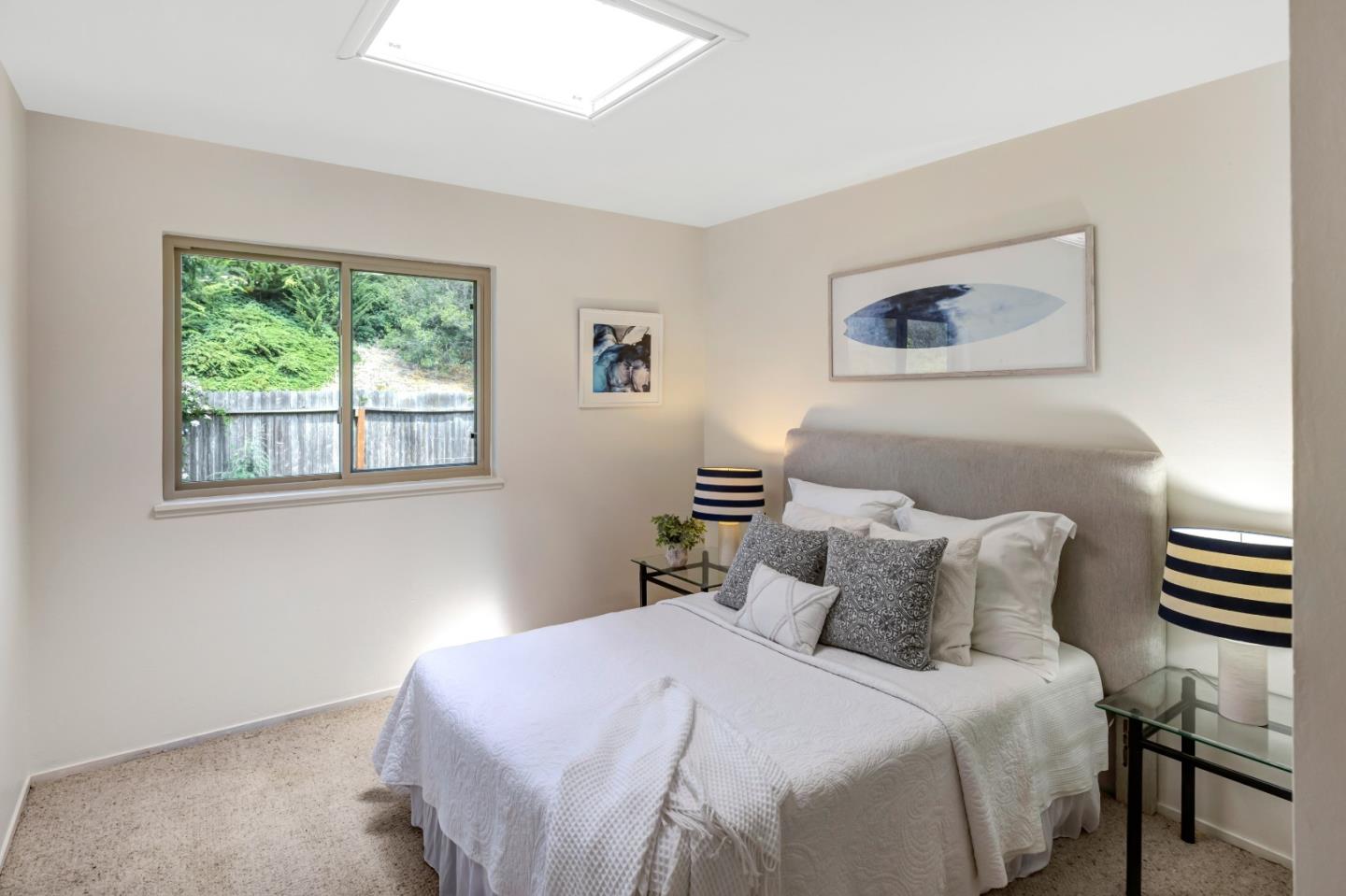 3370 Rio Road Carmel, CA 93923 - Photo 11 of 15 a bedroom with a bed and a window