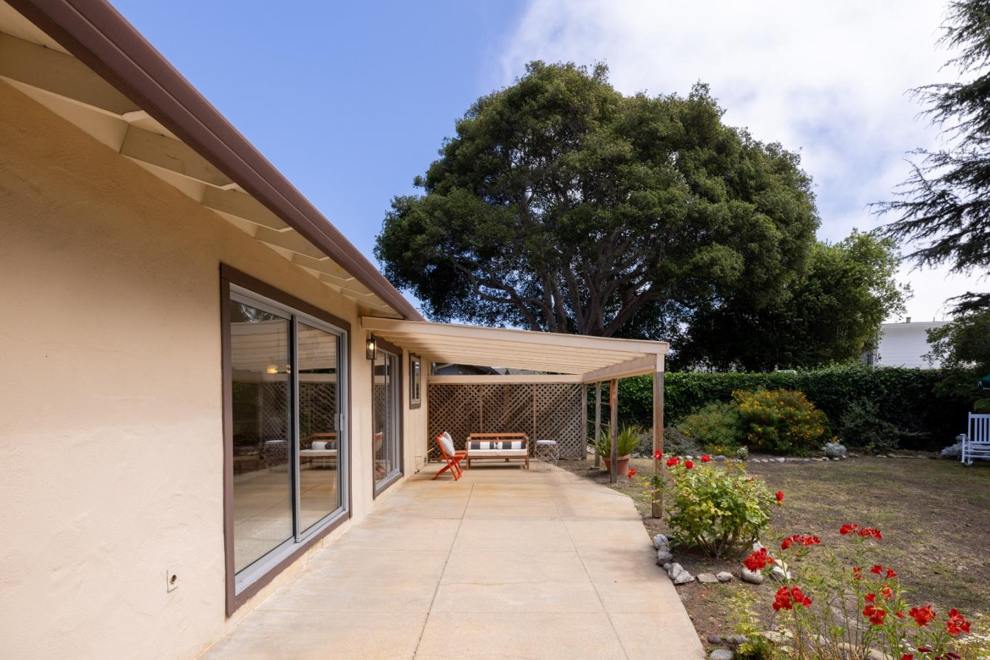 3370 Rio Road Carmel, CA 93923 - Photo 14 of 15 a view of house and garden with large trees