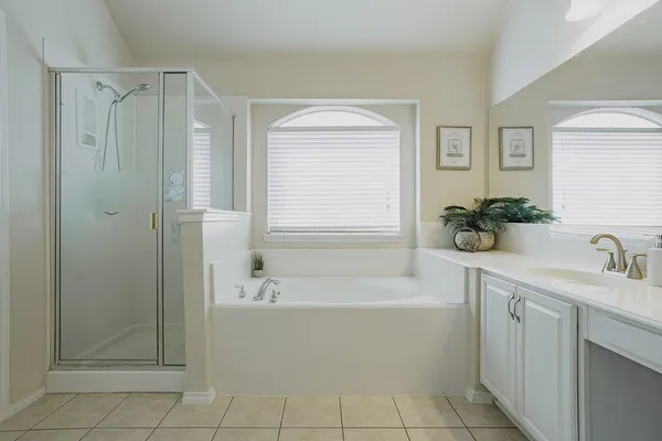 a bathroom with a bathtub and a sink